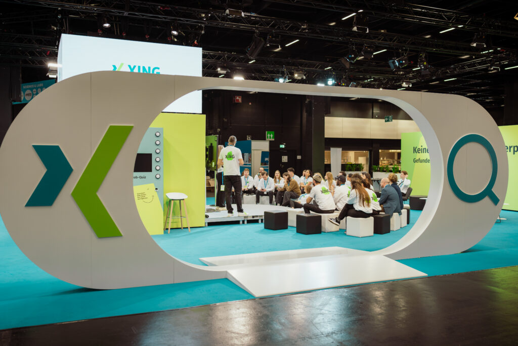 The entrance to a XING trade fair floor with a giant white XING search bar serving as the entrance door.